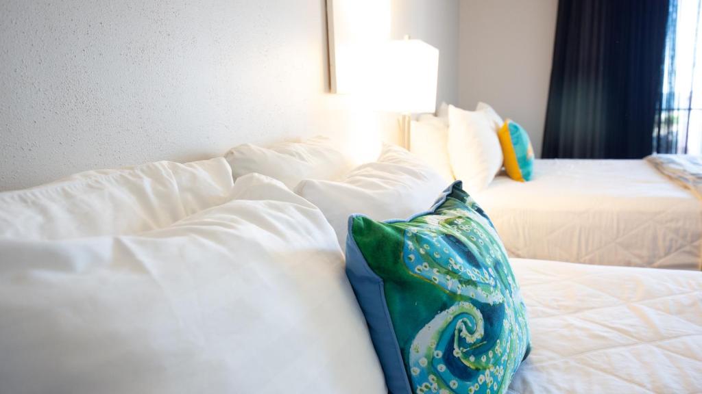 Postel nebo postele na pokoji v ubytování Periwinkle Inn