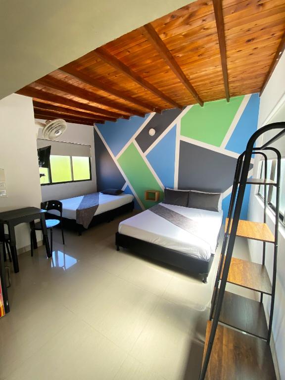Postel nebo postele na pokoji v ubytování 33 Hotel Bulerias