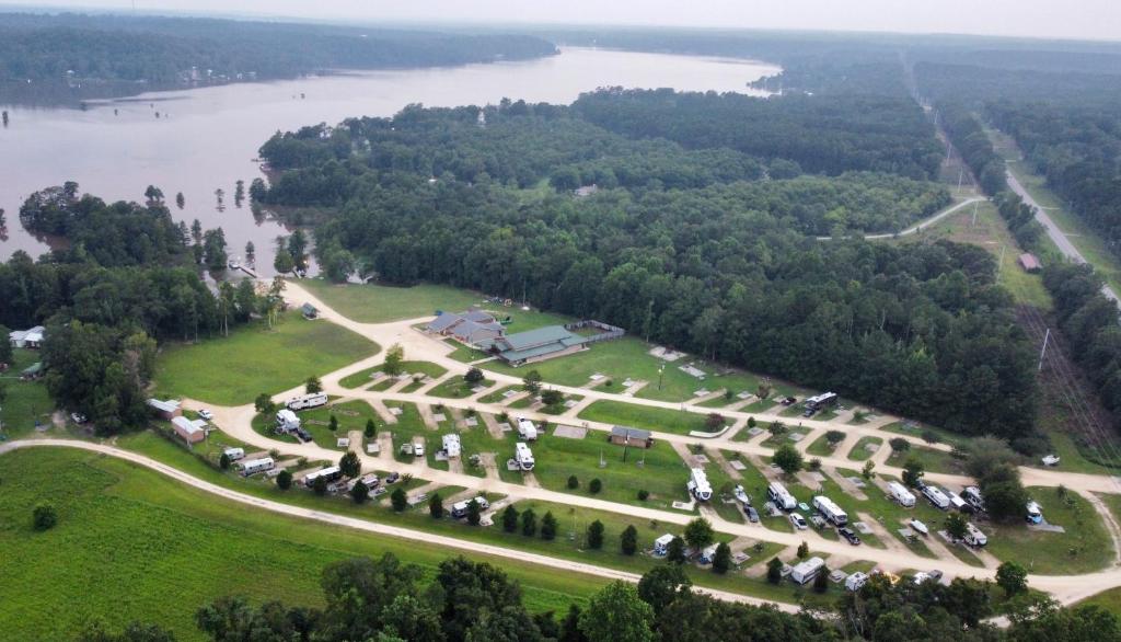 an aerial view of a park next to a river at Cypress Landing Cabins 