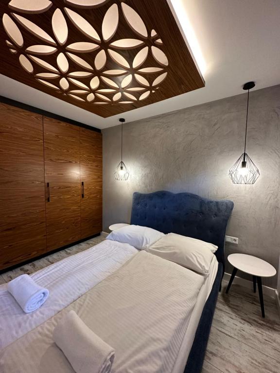 Posteľ alebo postele v izbe v ubytovaní Apartamenty Gubałówka