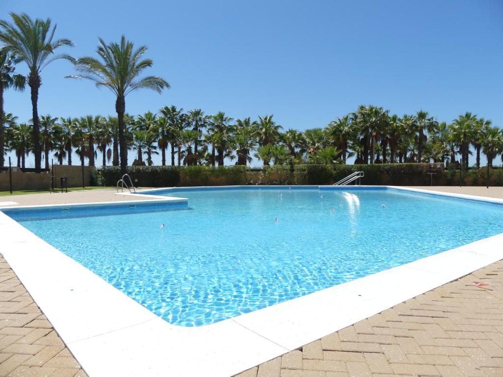 Bazén v ubytování Jardines de Isla Canela, planta baja. nebo v jeho okolí