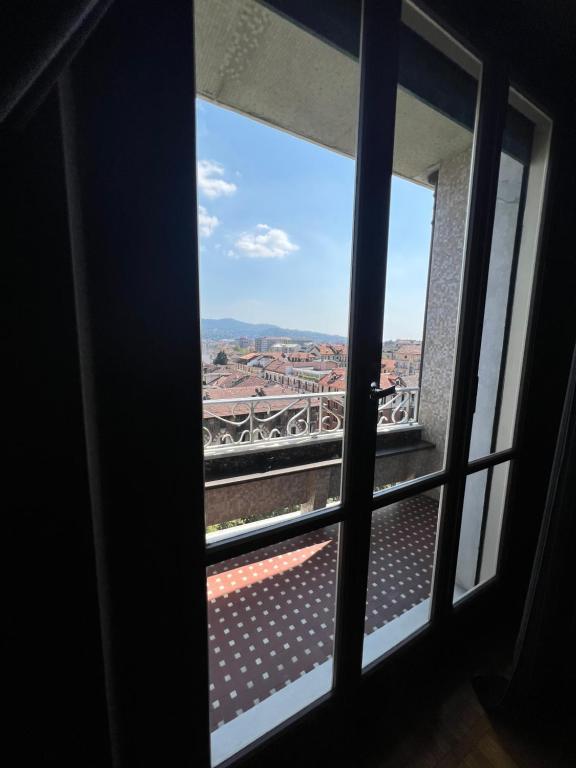 a window looking out at a view of a stadium at Alloggio Galileo in Turin