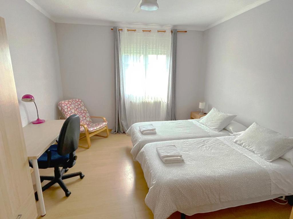 Postel nebo postele na pokoji v ubytování Villa Flores