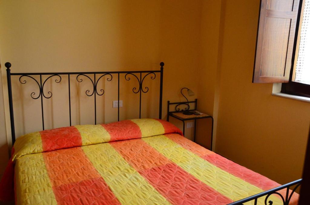 Posteľ alebo postele v izbe v ubytovaní B&B Il Casolare