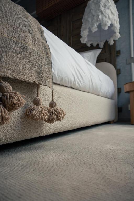 Postel nebo postele na pokoji v ubytování Les Palmiers Boutique Hôtel & Spa