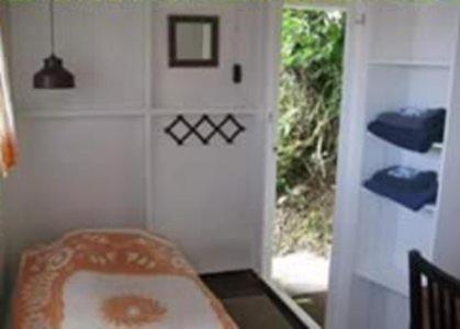 Postel nebo postele na pokoji v ubytování El Momo Cottages
