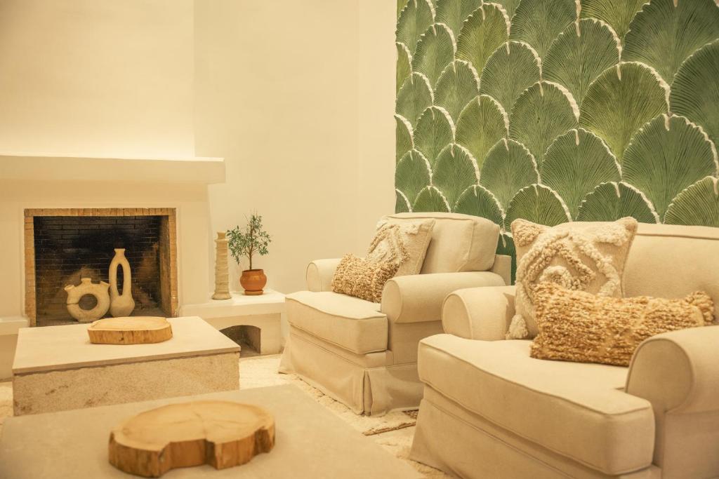 Posezení v ubytování Les Palmiers Boutique Hôtel & Spa