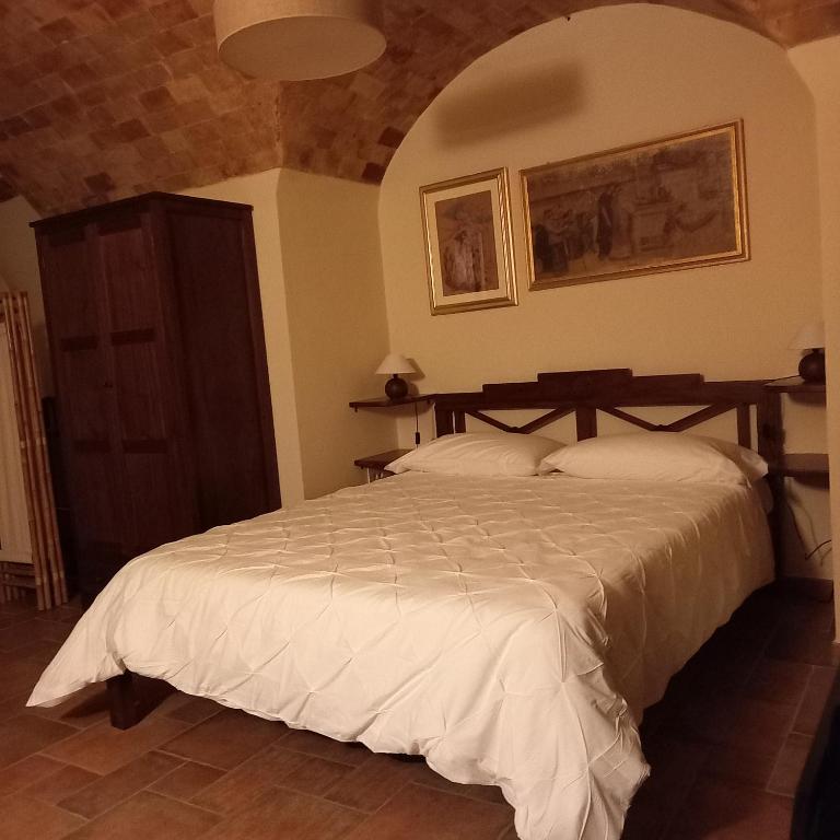 Postel nebo postele na pokoji v ubytování La Cisterna del Vicinato