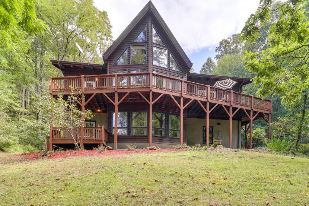 a large wooden house with a wrap around deck at Butler Retreat on 60 Acres Near Beech Mountain! in Beech Mountain