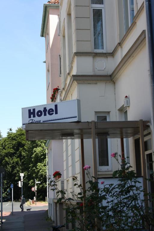 a hotel sign on the side of a building at Hotel Flora in Hannover