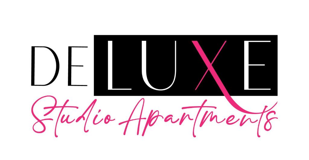 a sign for a dance studio with a pink ribbon at Deluxe Studio Apartments in Derby