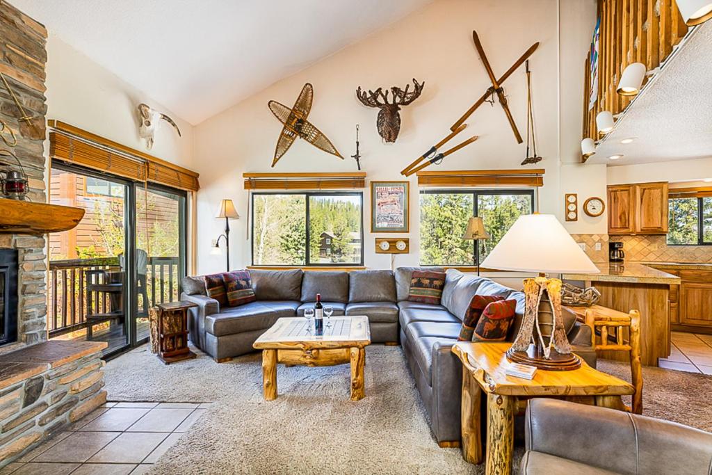 a living room with a couch and a fireplace at Pine Ridge 05E in Breckenridge