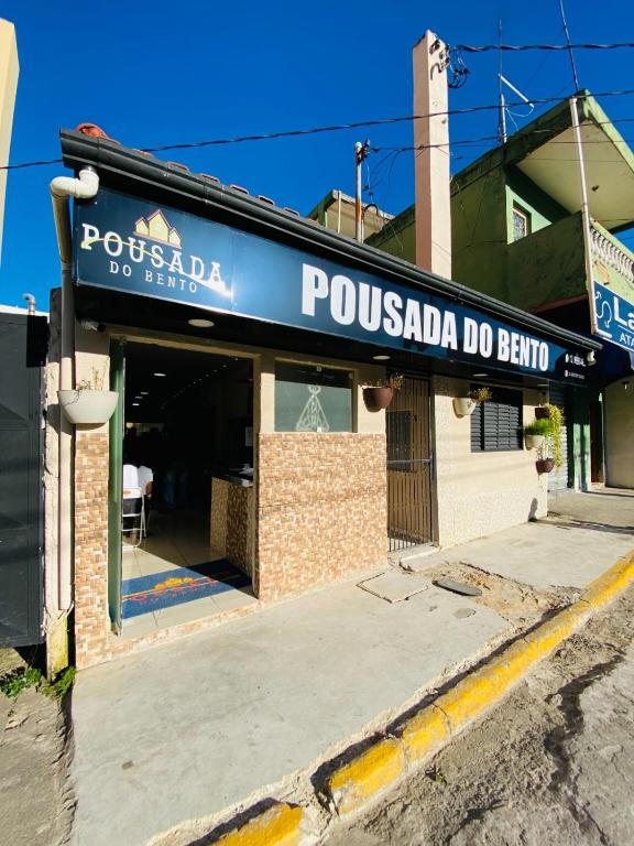 a restaurant with a sign that readsossada do bar at H POUSADA DO BENTO in Aparecida