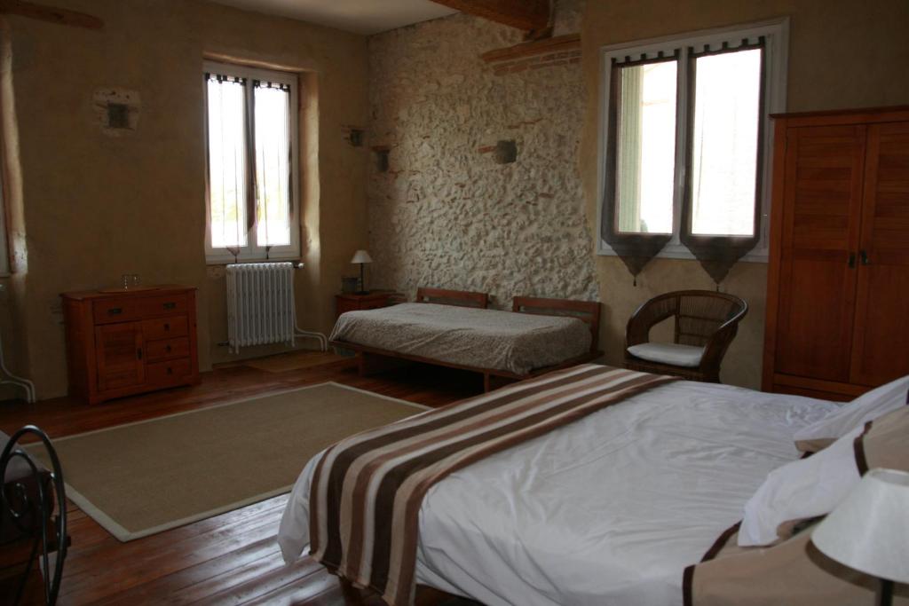 Postel nebo postele na pokoji v ubytování Un Coin de Paradis