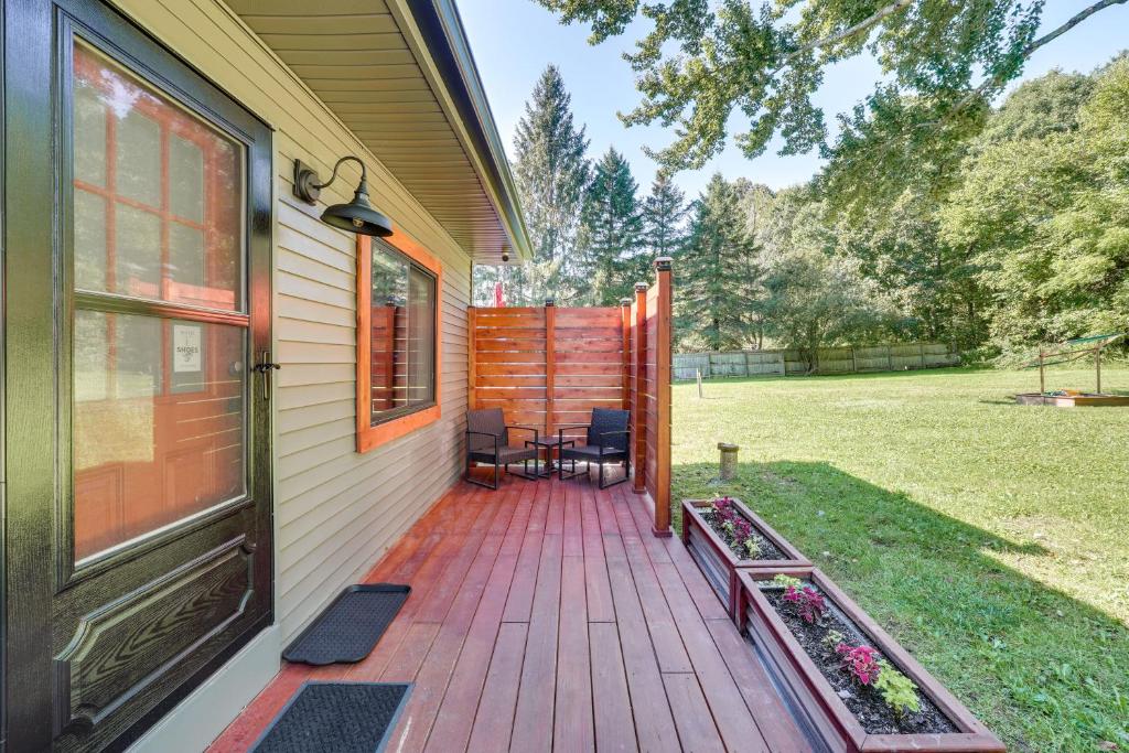 a porch of a house with a wooden deck at Wallkill Apartment with Private Patio 6 Mi to Town! in Wallkill