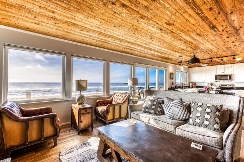 a living room with a couch and a table at Neskowin Beach Escape in Neskowin