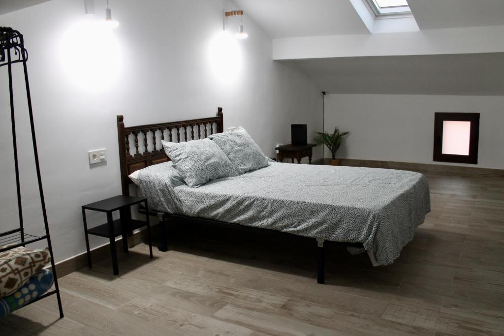 a bedroom with a bed with a pillow on it at La Carbonera in Alaejos