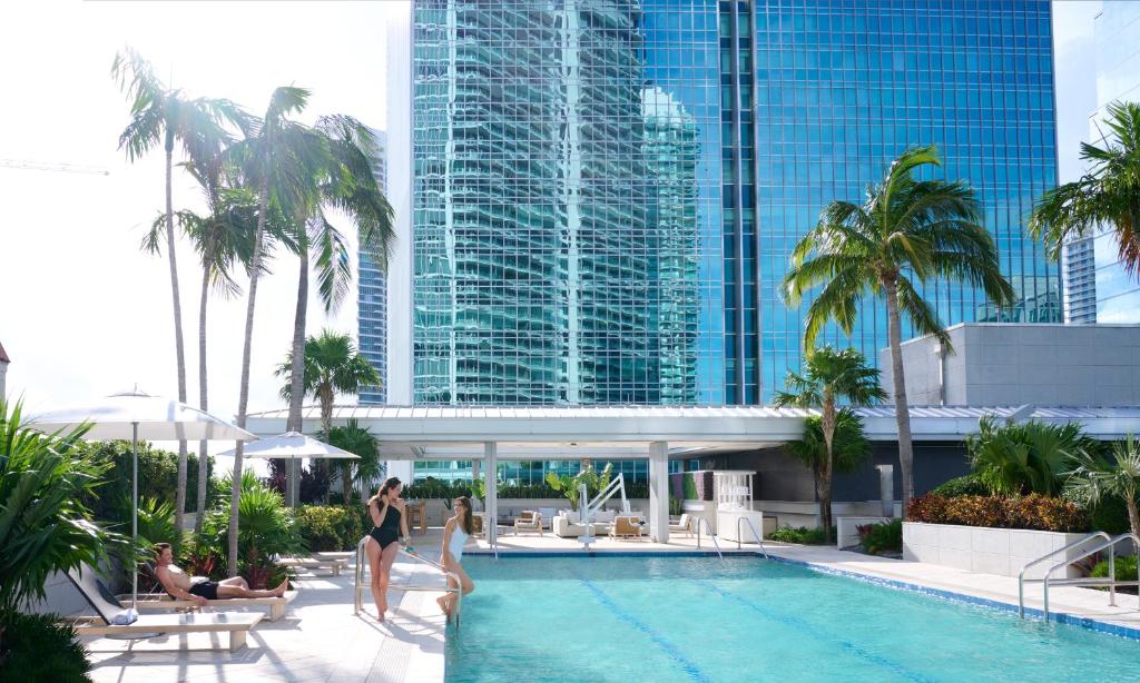 a rendering of a hotel swimming pool with people in it at Hotel AKA Brickell in Miami