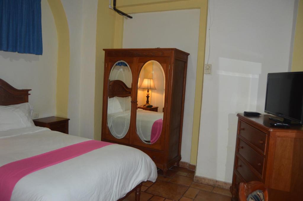Postel nebo postele na pokoji v ubytování Hotel Meson del Mar