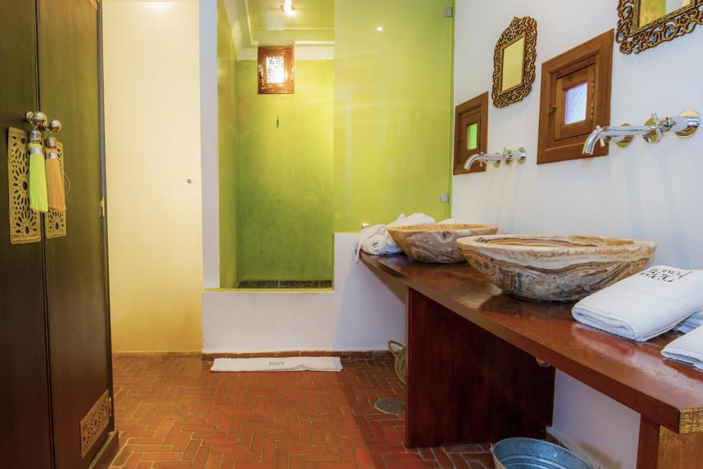 a bathroom with a sink and a mirror at Hotel Blanco Riad in Tetouan