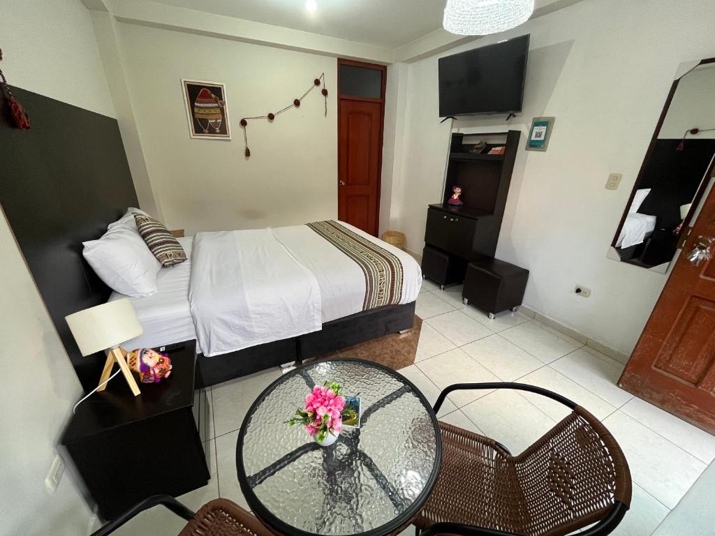 Ένα ή περισσότερα κρεβάτια σε δωμάτιο στο Cusco Rooms