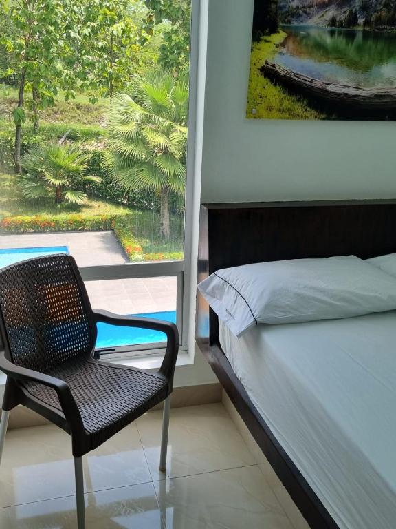Postel nebo postele na pokoji v ubytování Hotel Puerto Triunfo