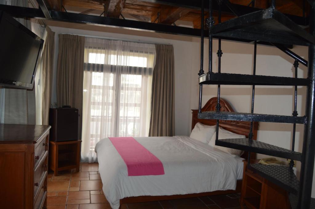 Postel nebo postele na pokoji v ubytování Hotel Meson del Mar