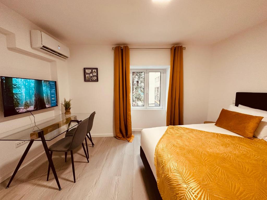 Postel nebo postele na pokoji v ubytování Living Funchal iNN