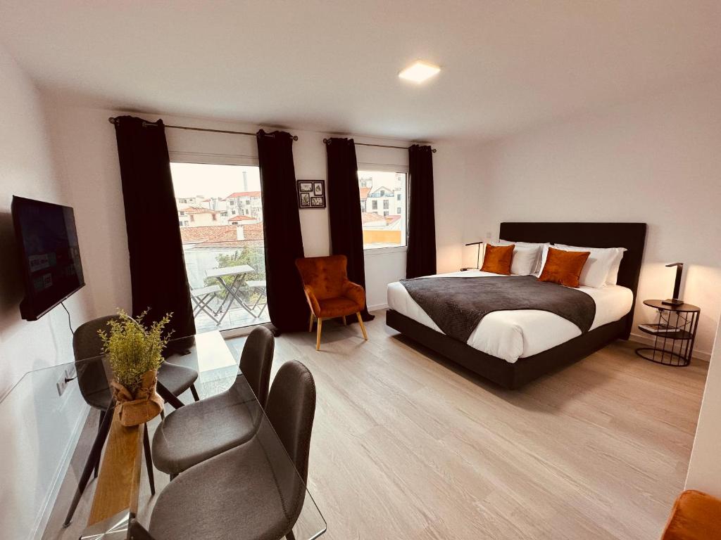 Postel nebo postele na pokoji v ubytování Living Funchal iNN