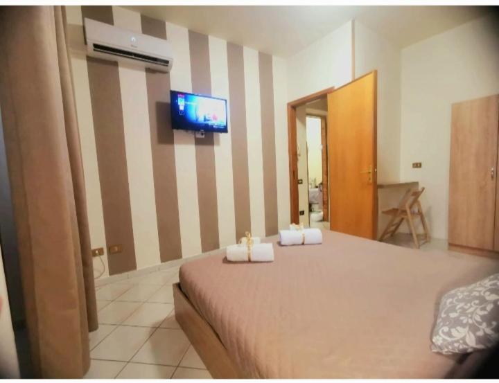 A bed or beds in a room at La Perla di Palermo