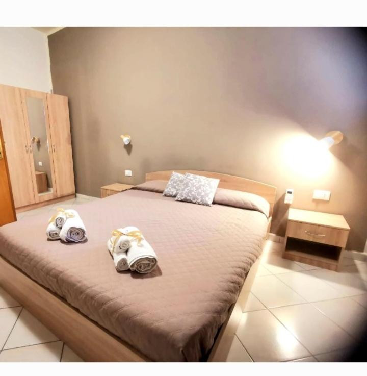 A bed or beds in a room at La Perla di Palermo