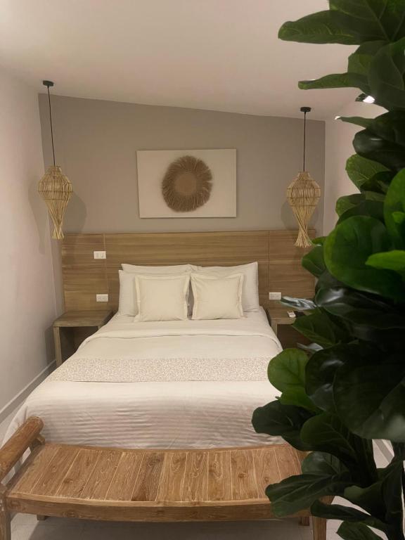 Postel nebo postele na pokoji v ubytování Moet Medellin Hotel