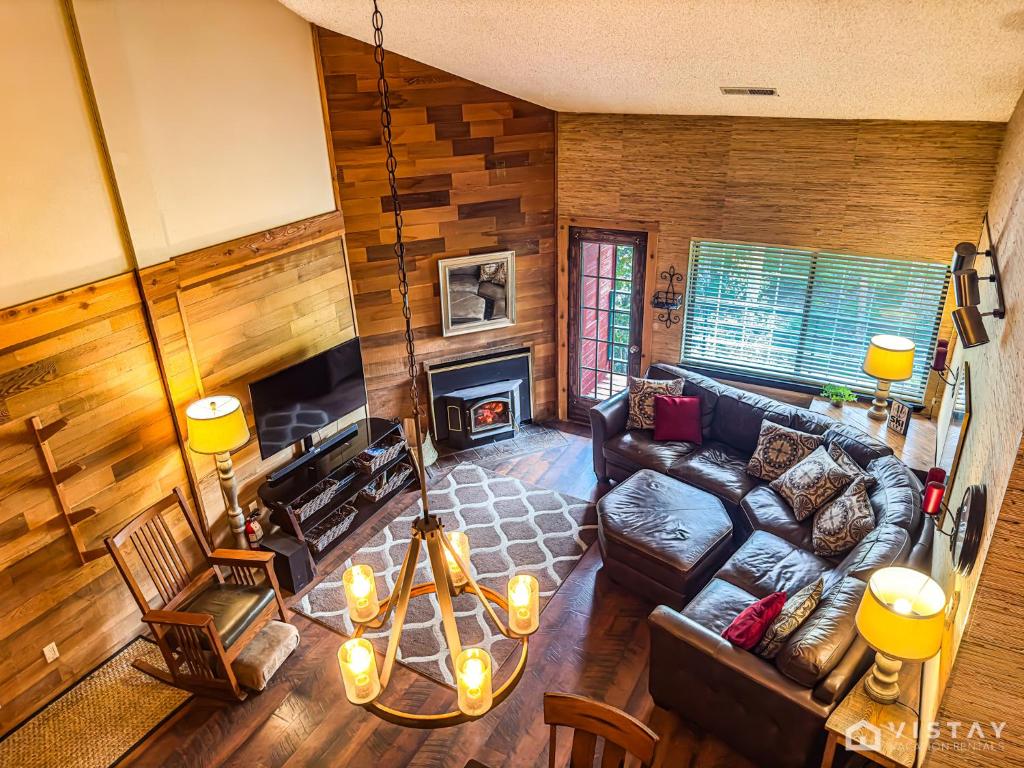 a living room with a couch and a fireplace at Premium Ski In Ski Out At Giants Steps Chairlift! in Brian Head