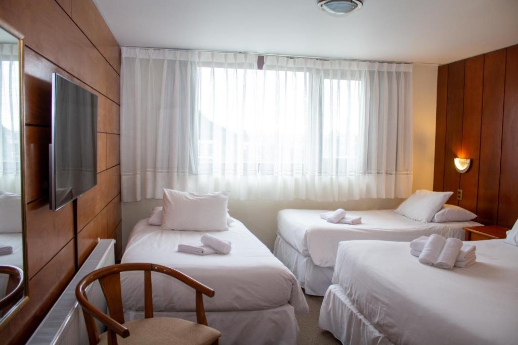 Postel nebo postele na pokoji v ubytování Hotel Germania