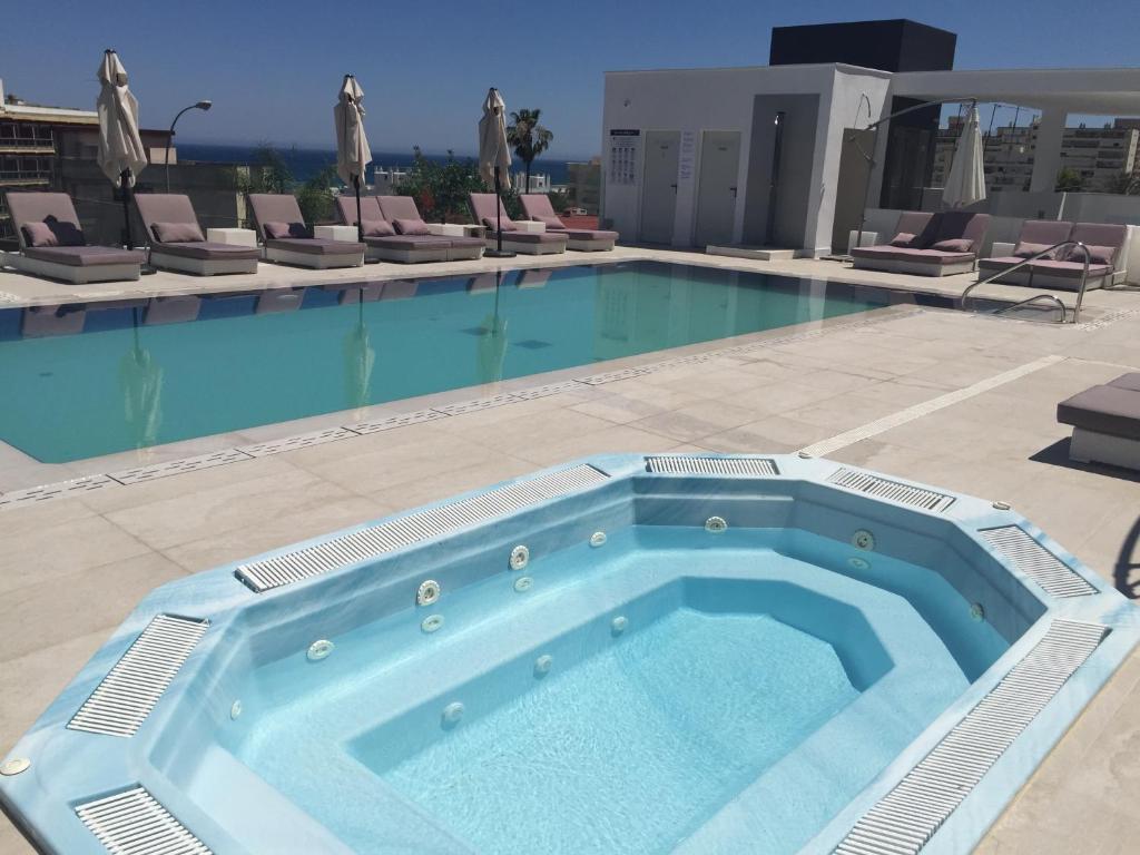 a large swimming pool on top of a building at Hotel Natursun in Torremolinos