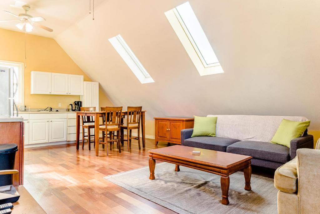 a living room with a couch and a table at Portland Urban Lodge, Quiet, Walkable, Near in Portland