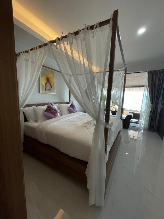 Postel nebo postele na pokoji v ubytování BeachHouse Pool Villas Krabi