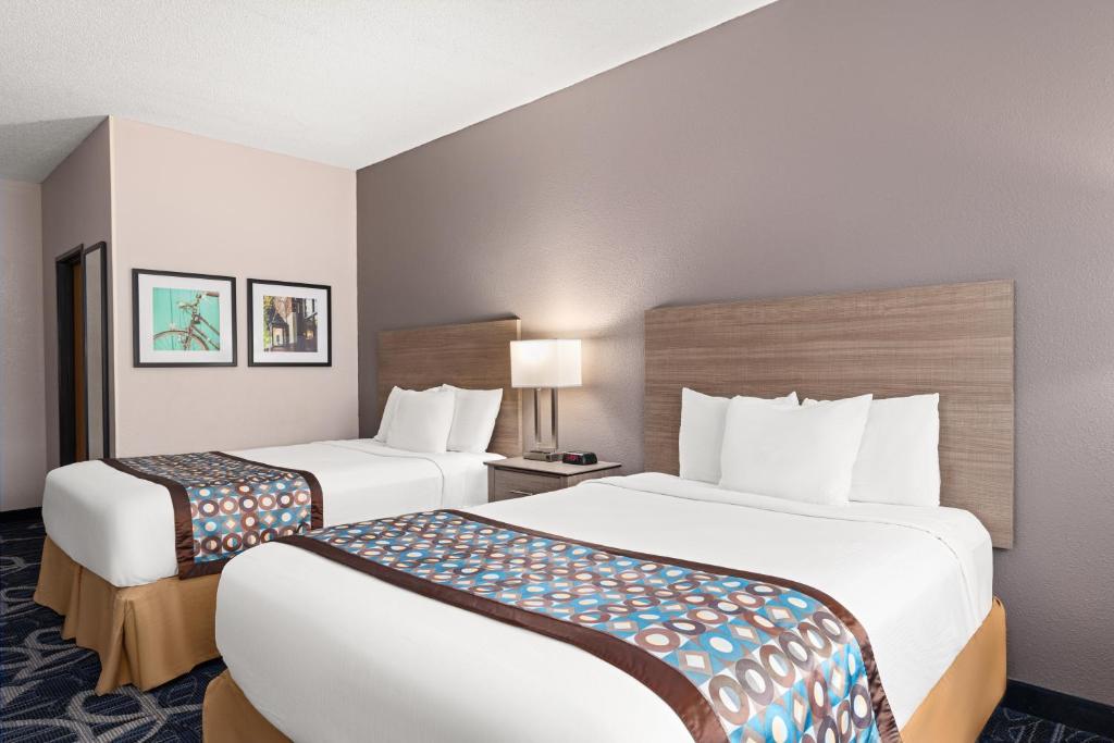 Ein Bett oder Betten in einem Zimmer der Unterkunft Baymont by Wyndham Waterloo