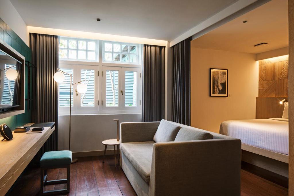 Giường trong phòng chung tại KēSa House, The Unlimited Collection managed by The Ascott Limited