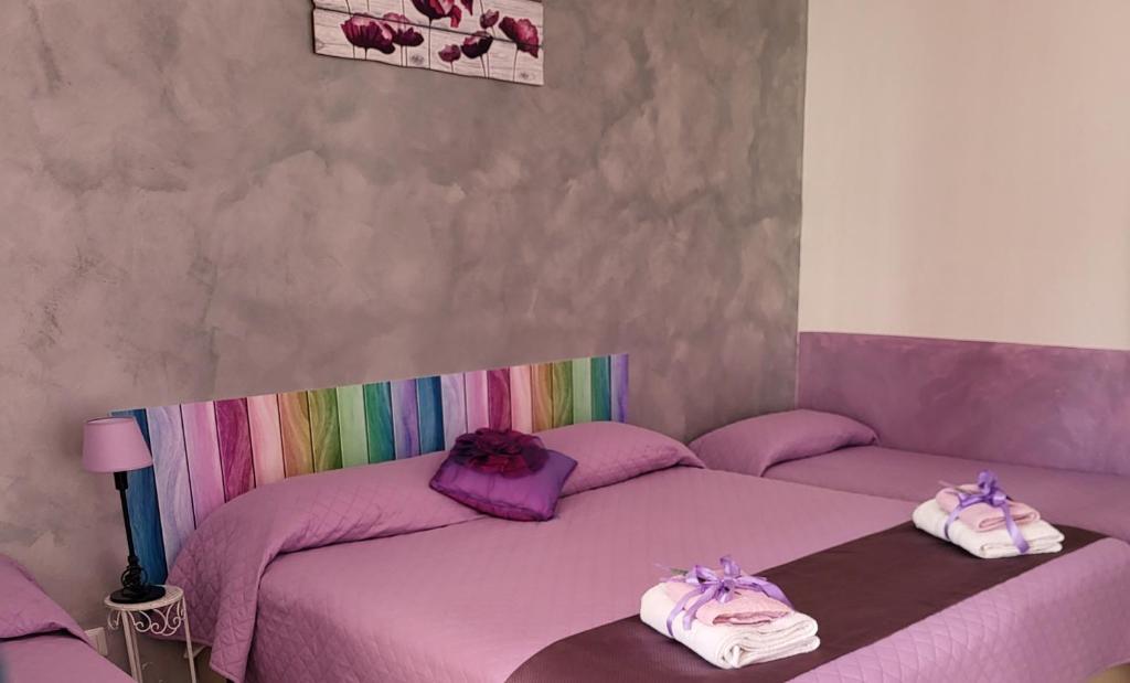 Postel nebo postele na pokoji v ubytování B&B Dimora del centro