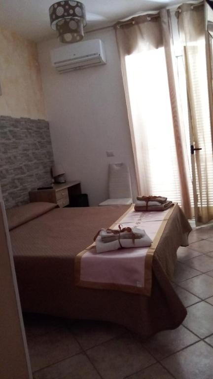 Postel nebo postele na pokoji v ubytování B&B Dimora del centro
