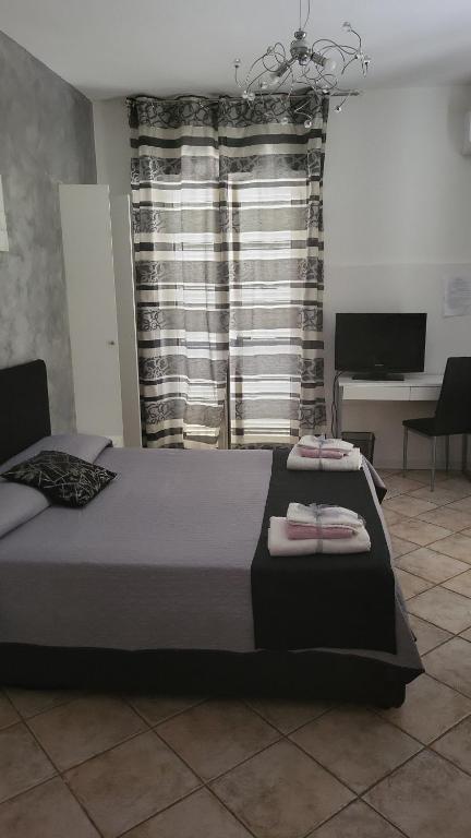 Postel nebo postele na pokoji v ubytování B&B Dimora del centro
