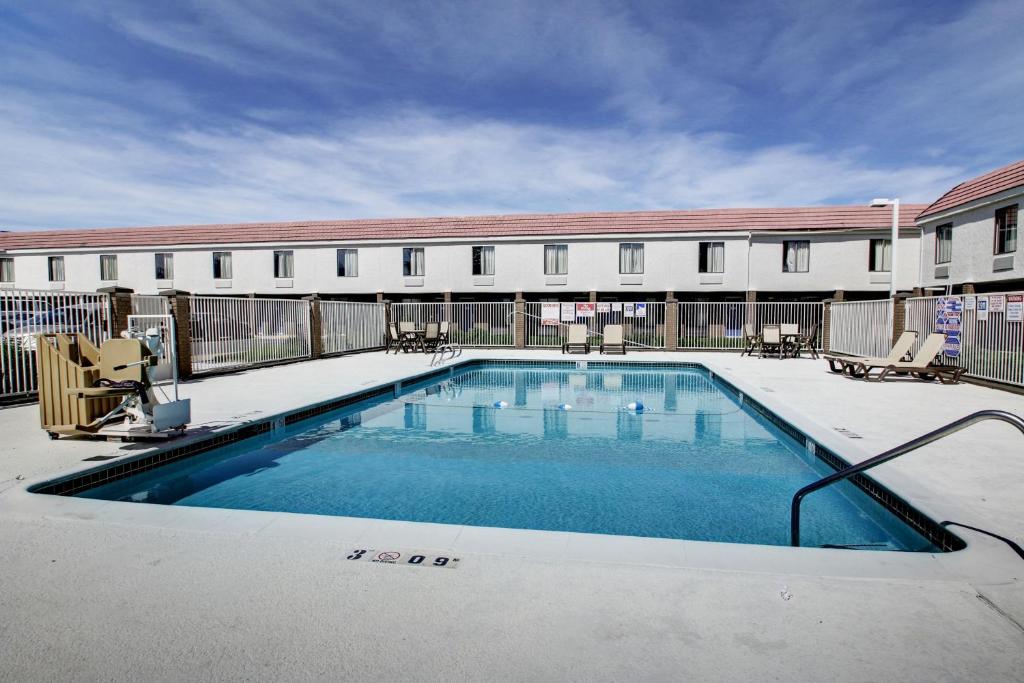 a swimming pool in front of a building at Motel 6-Ogden, UT - Riverdale in Ogden
