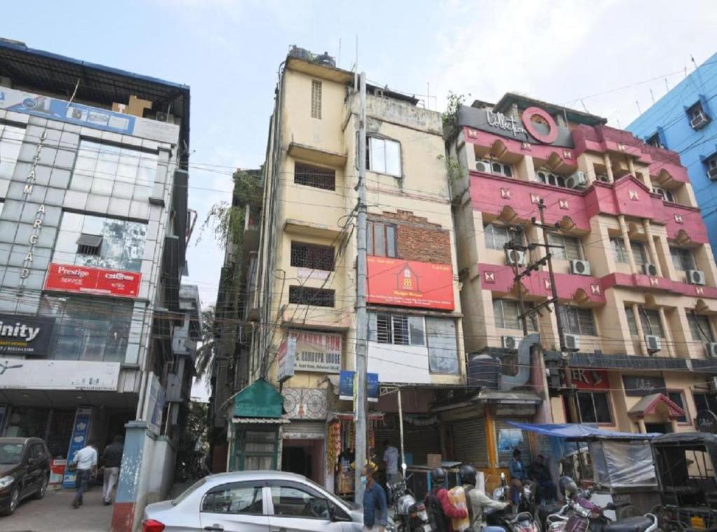 a group of buildings on a busy city street at B&B HOMES Guwahati in Guwahati