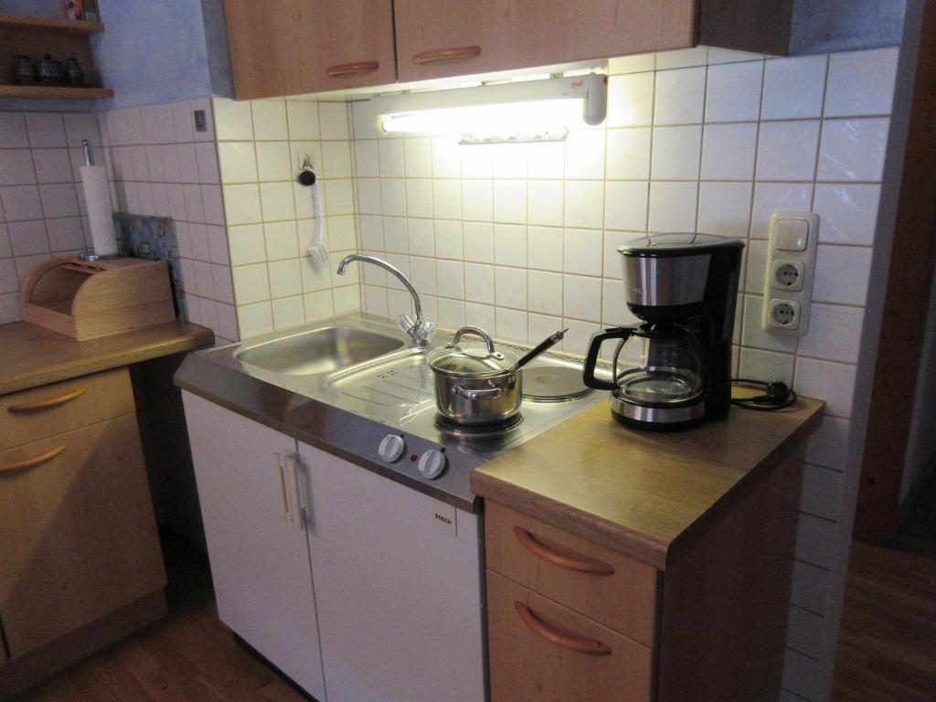 Kuchyň nebo kuchyňský kout v ubytování Geppingerhof