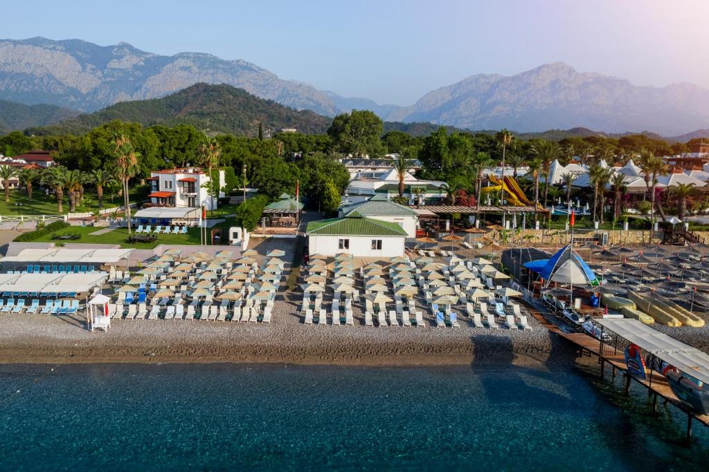 an aerial view of a water park with a lot of chairs at Simena Comfort Hotel in Kemer