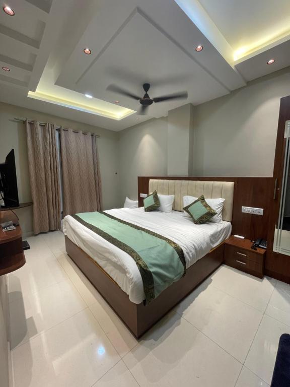 Säng eller sängar i ett rum på Vishwanath Inn