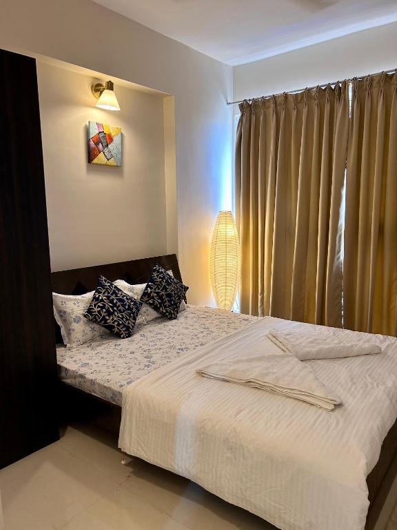 Postel nebo postele na pokoji v ubytování TATA Rio De Goa, Good Stay 2 BHK Pool View Premium Apartment, 805