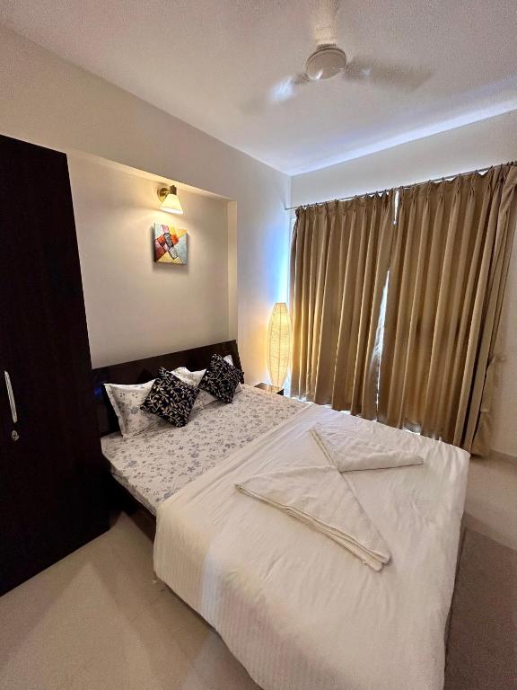 Postel nebo postele na pokoji v ubytování TATA Rio De Goa, Good Stay 2 BHK Pool View Premium Apartment, 805