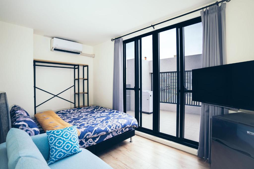 谷園酒店公寓Good Garden Apartment房間的床